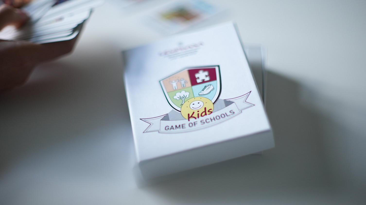Schachtel des Kartenspiels „Game of Schools – Kids“