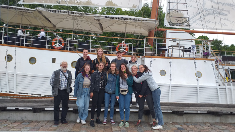 Group photo in front of a ship in Klaipeda, Lithuania