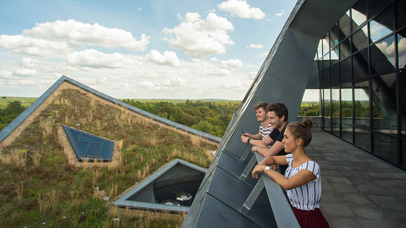 Students on a balcony of the central building