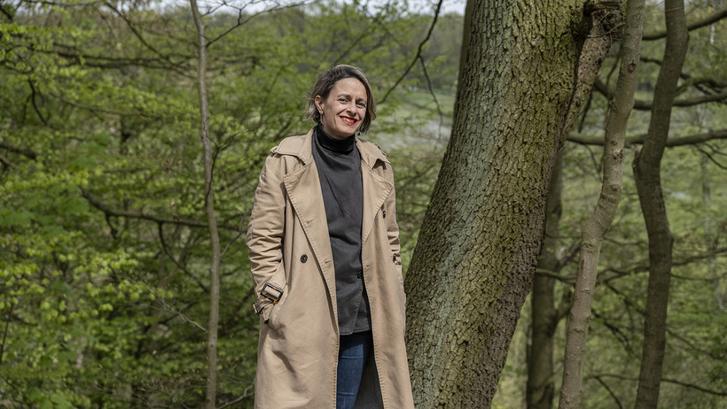 LIAS Fellow Maud Meyzaud, standing besides a tree