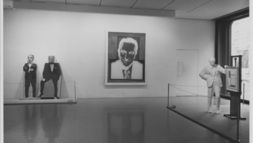 Installation view of the exhibition "The Sidney and Harriet Janis Collection" featuring Marisol’s Portrait of Sidney Janis Selling Portrait of Sidney Janis by Marisol, by Marisol (1967-68), Andy Warhol’s Silkscreen for Portrait of Sidney Janis (1967) and George Segal’s Portrait of Sidney Janis with Mondrian Painting (1967) at The Museum of Modern Art, New York, January 17, 1968–March 4, 1968. 