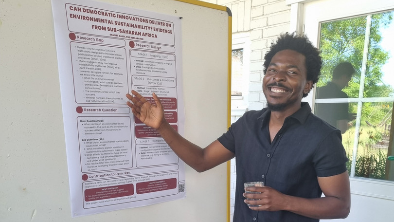 PhD candidate Samuel Gausi presents his scientific poster