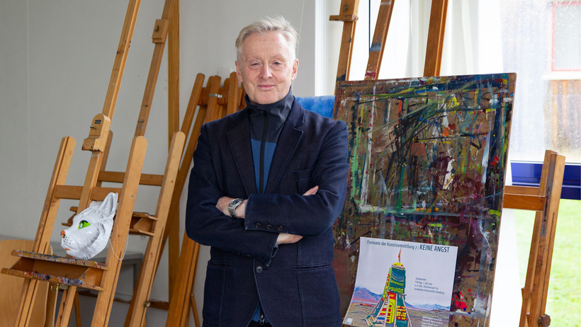 Prof. Dr. Pierangelo Maset in front of an easel 