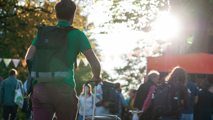 Student travels to campus with suitcase